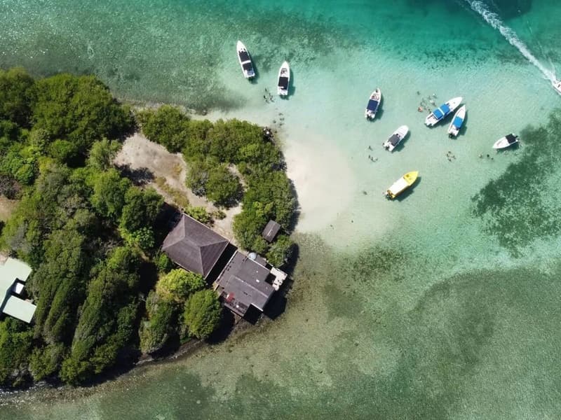 Aerial view of an islet and boats on the sandbank at Josephine’s Bath
